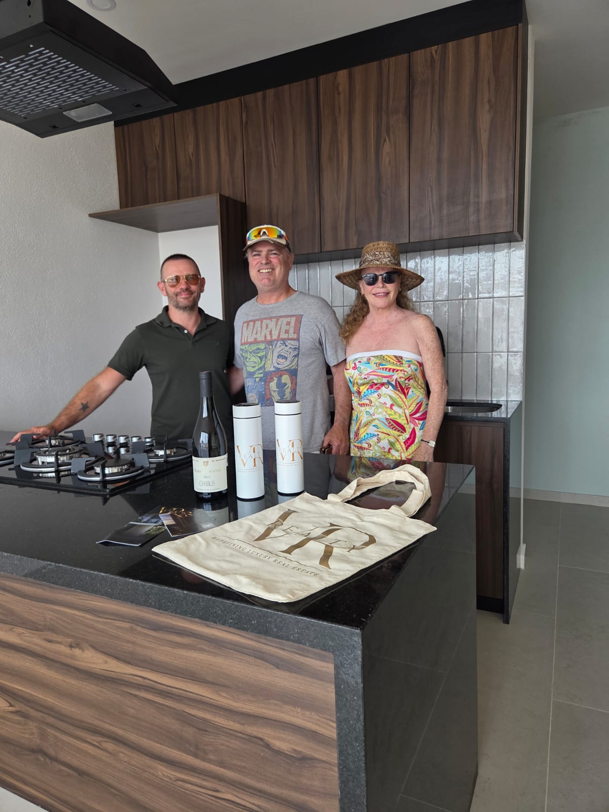Two happy homeowners receiving keys to their new presale condo in Puerto Vallarta at Vrede development