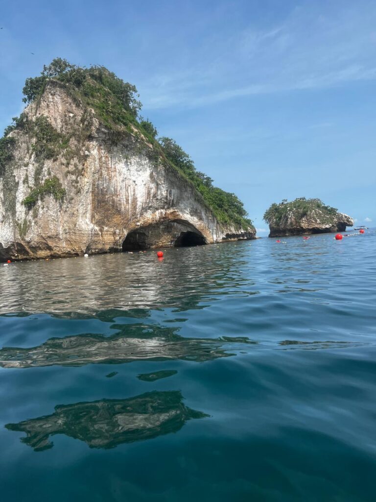 Scenic view of Los Arcos rock formations in Puerto Vallarta with clear blue ocean and sky