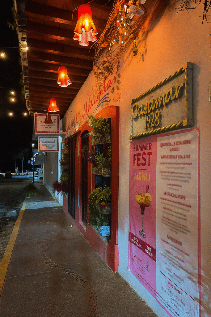 Warmly lit exterior of a traditional Mexican café in Puerto Vallarta at night