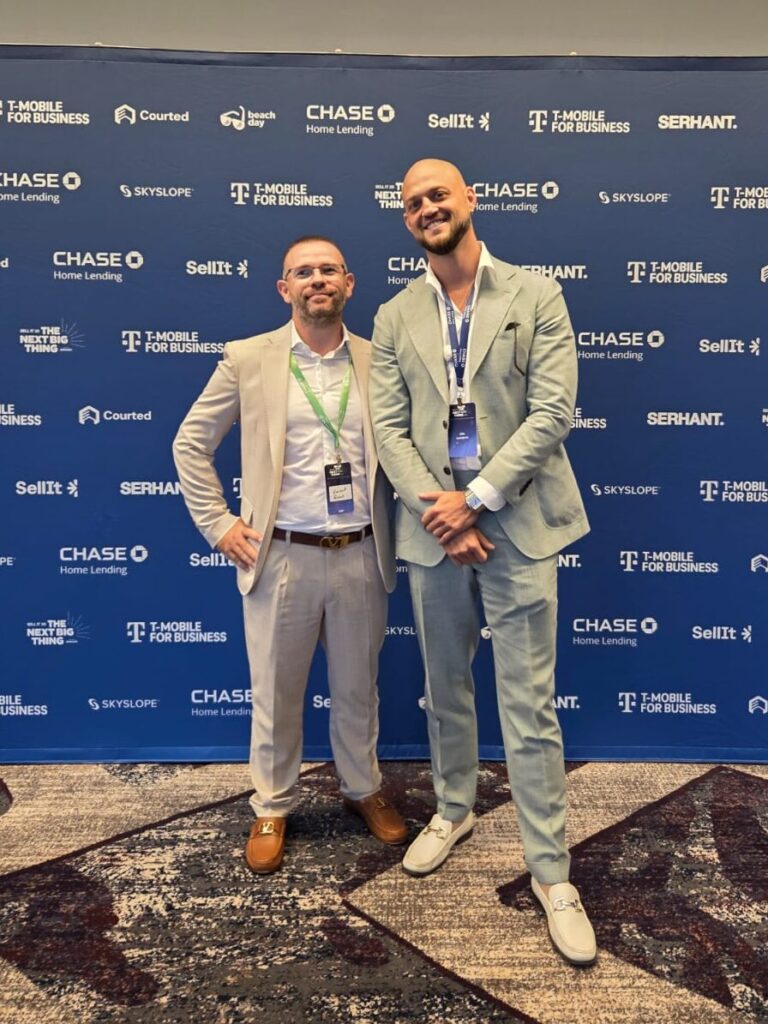 Two real estate professionals networking at a real estate conference in Puerto Vallarta