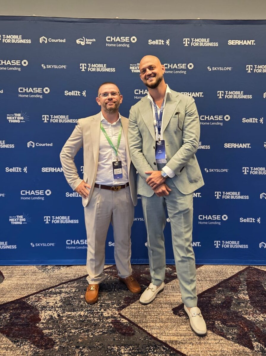 Two real estate professionals networking at a real estate conference in Puerto Vallarta