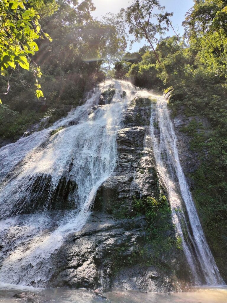 Hidden jungle waterfall near Puerto Vallarta surrounded by lush tropical forest in the Sierra Madre mountains