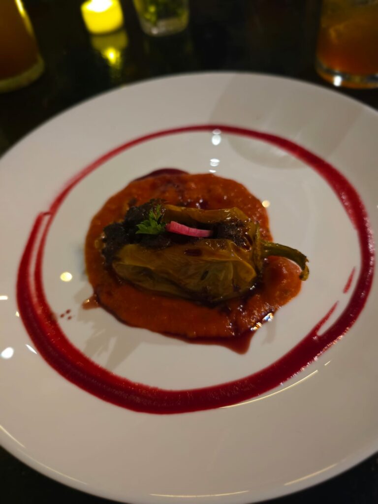 Gourmet fine dining dish served in an upscale restaurant, illustrating gastronomy's influence on neighborhood appeal and real estate appreciation