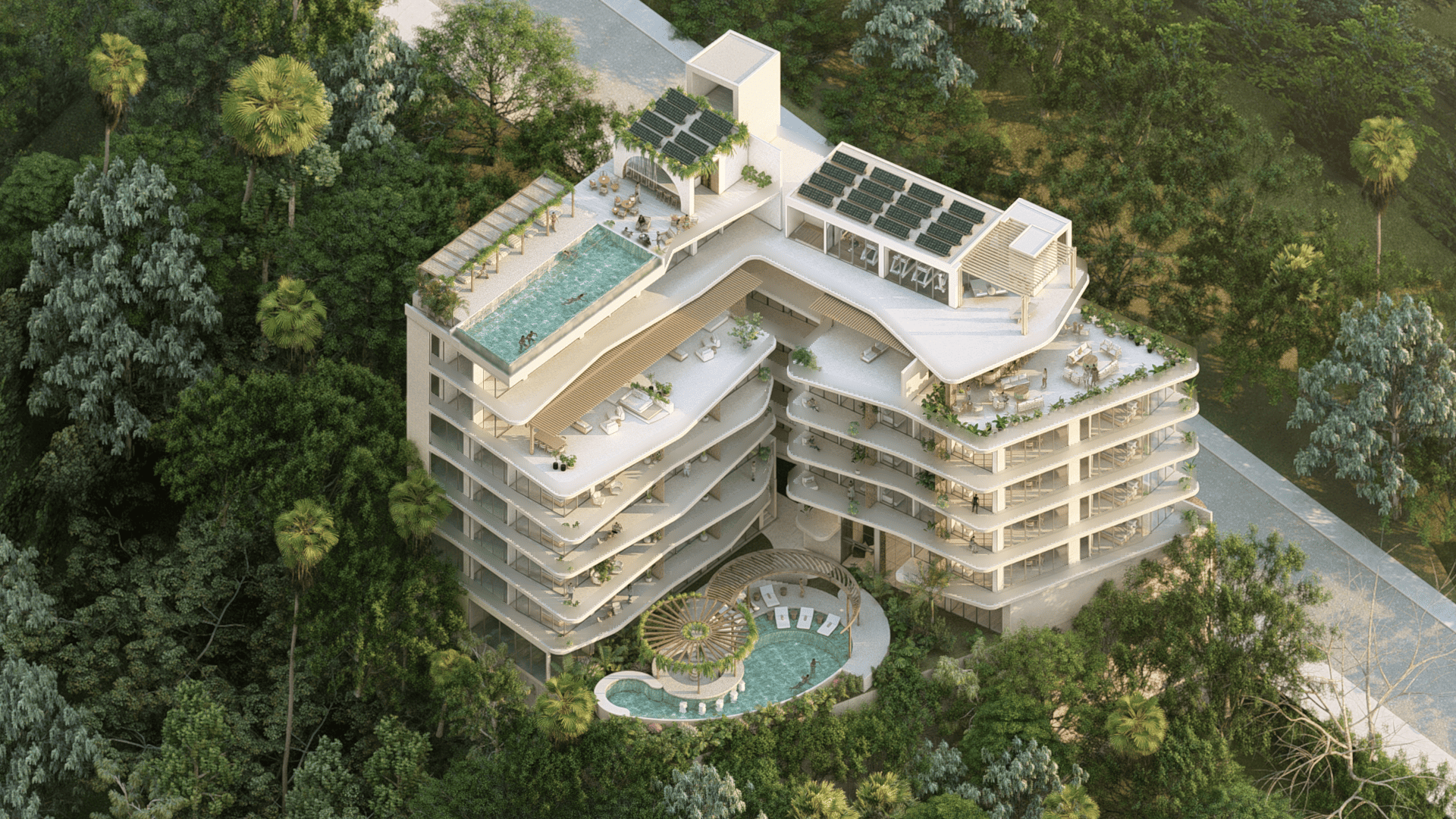 Aerial view of luxury condominium with rooftop infinity pool and tropical surroundings in Puerto Vallarta.