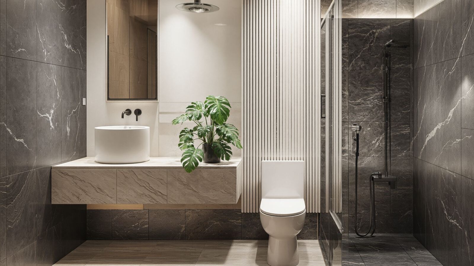 Modern luxury bathroom with marble finishes and walk-in shower in a Puerto Vallarta condominium.