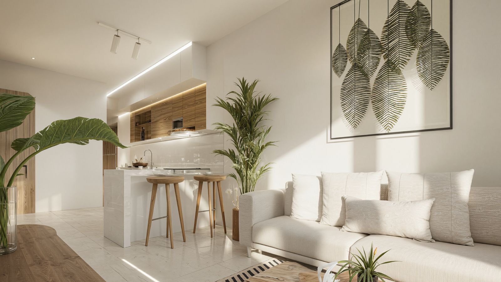 Open-concept living room and modern kitchen inside a luxury condominium in Puerto Vallarta.