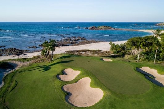 Golfer on a world-class course in Banderas Bay with stunning ocean views
