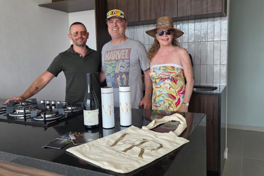 Two happy homeowners receiving keys to their new presale condo in Puerto Vallarta at Vrede development