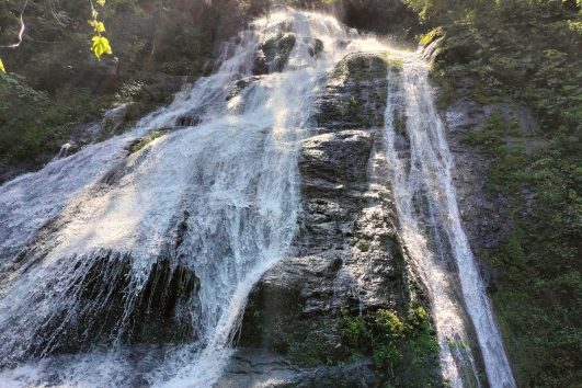 Hidden jungle waterfall near Puerto Vallarta surrounded by lush tropical forest in the Sierra Madre mountains
